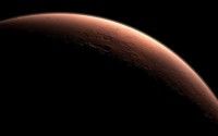 Imagen generada por ordenador por la agencia espacial estadounidense NASA, y distribuida el 24 de agosto pasado que muestra el contorno de Marte con la luz del Sol en el amanecer del 'planeta rojo'. Foto: NASA/AFP