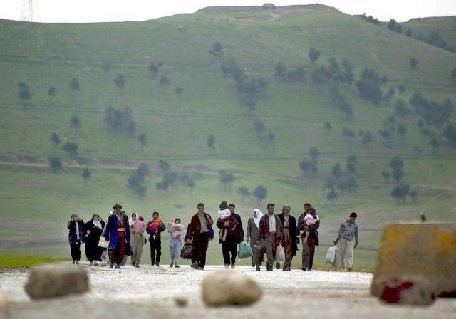 Kurdos que huyen de la guerra. Foto: New York Times